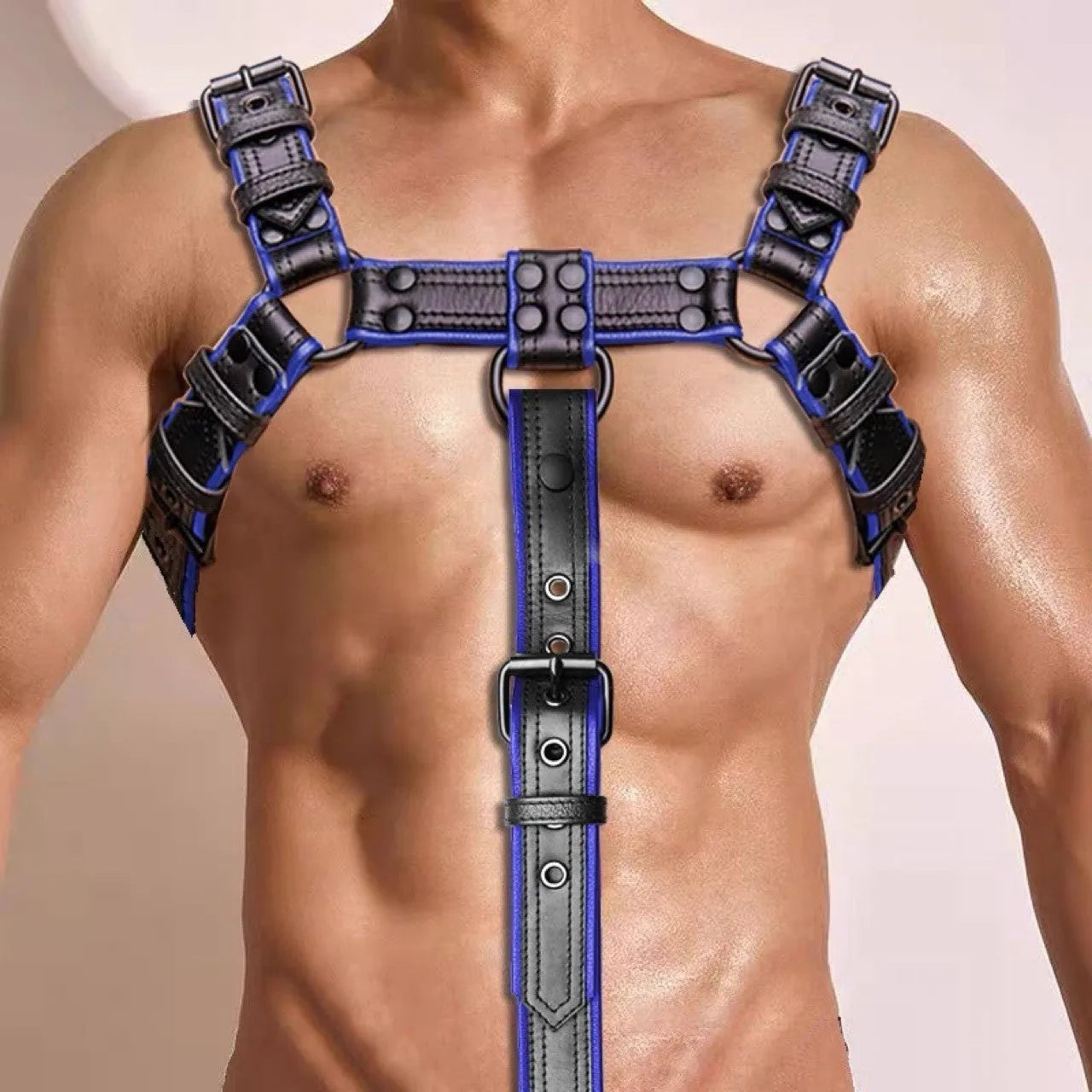 Blue and black leather adjustable shoulder strap with metal buckle and rivet hardware for binding restraint use