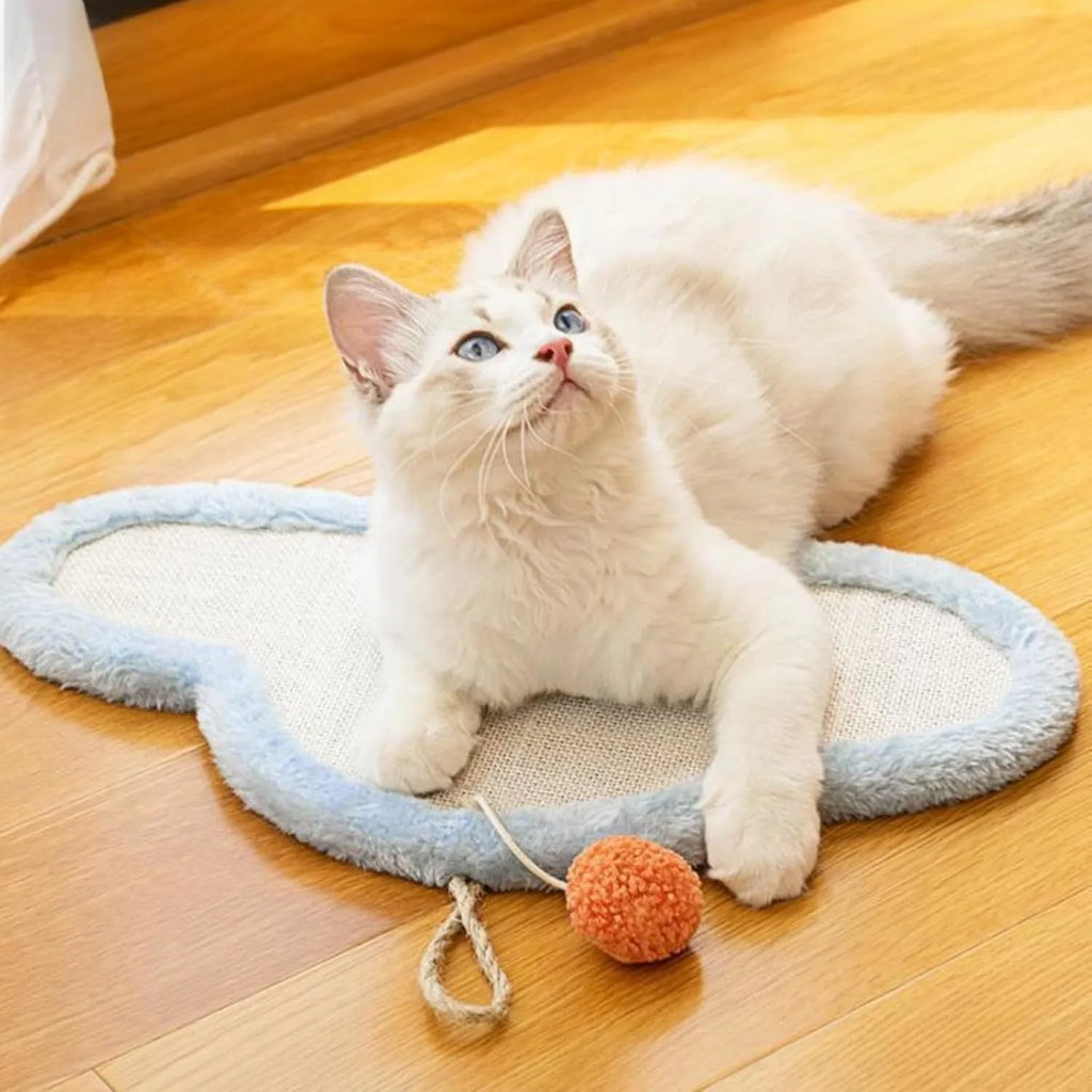 White cat scratching mat with sleeping cat pattern and curved shape
