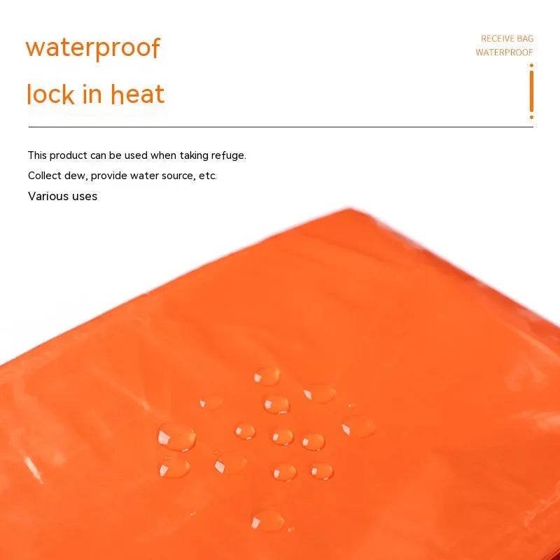 Orange emergency survival tent with sleeping bag and blanket for disaster relief