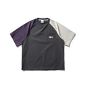 Dark grey men's loose fit t-shirt with contrasting colour panels on the raglan sleeves.