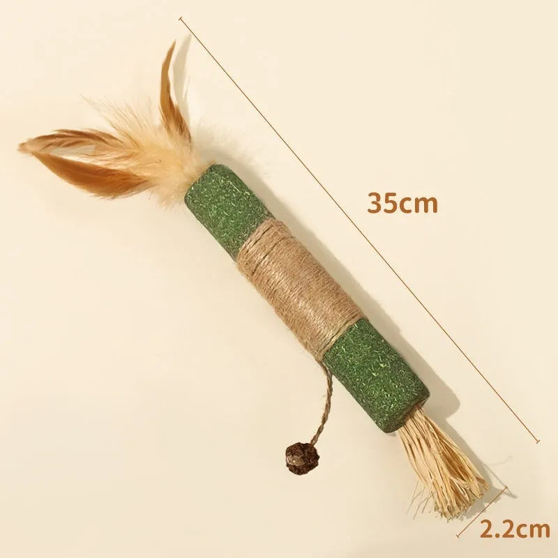 Natural wood cat teething chew rod with Lafite grass and catnip, 2.2cm diameter, shown with raffia scarecrow style