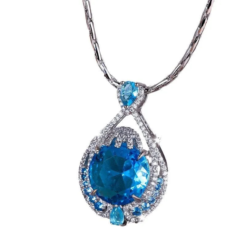 Blue geometric women's necklace with fireworks cut gems on water wave chain