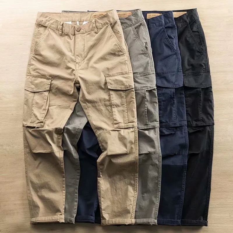 Man wearing khaki coloured multi-pocket cotton cropped work trousers.