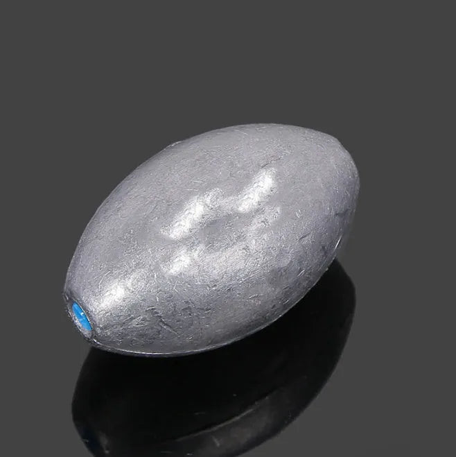 Olive lead fishing sinker with plastic core, rugby shape, and scale pattern in weights from 10g to 150g
