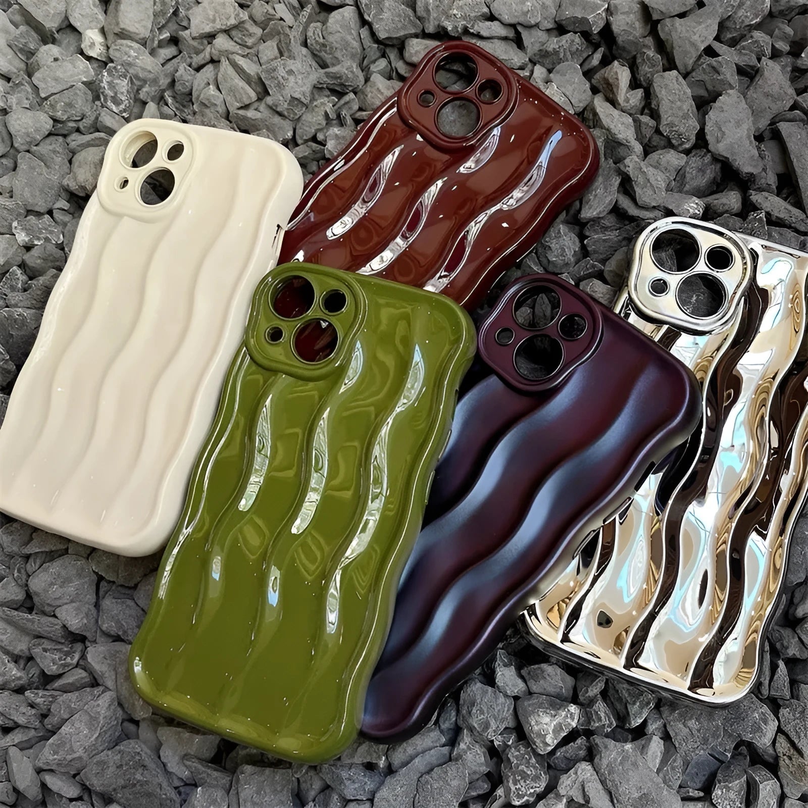 Silicone iPhone case with water ripple texture in green, shown on an iPhone 17 model