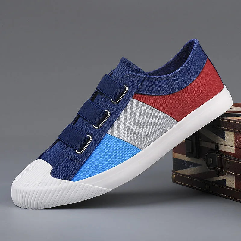 Men's beige canvas low-top sneakers with elastic band closure and a flat rubber sole