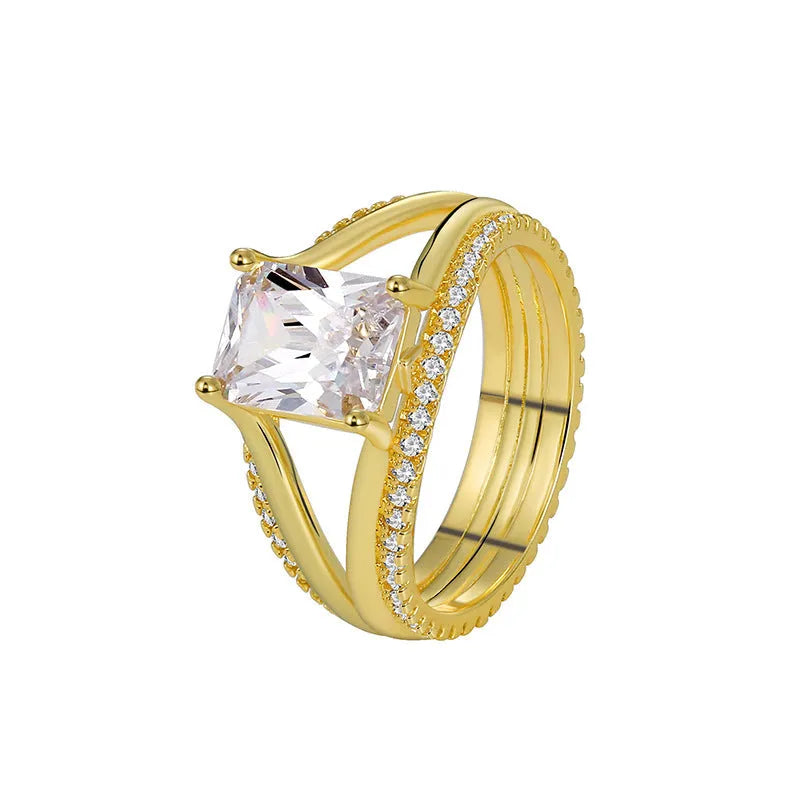 Gold geometric zircon ring for women on a plain background, showing its electroplated copper construction and minimalist design.