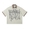 Men's loose blue cotton top with asymmetric design and graffiti print on the lapel.