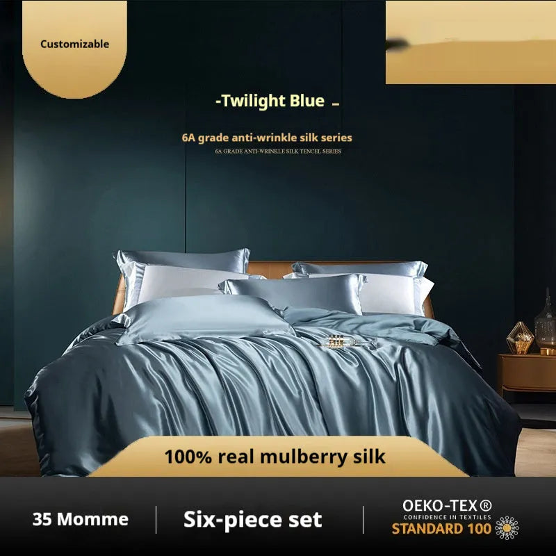 Silk four-piece quilt cover set in a solid colour displayed on a bed, showing the quilt cover and matching pillowcases.