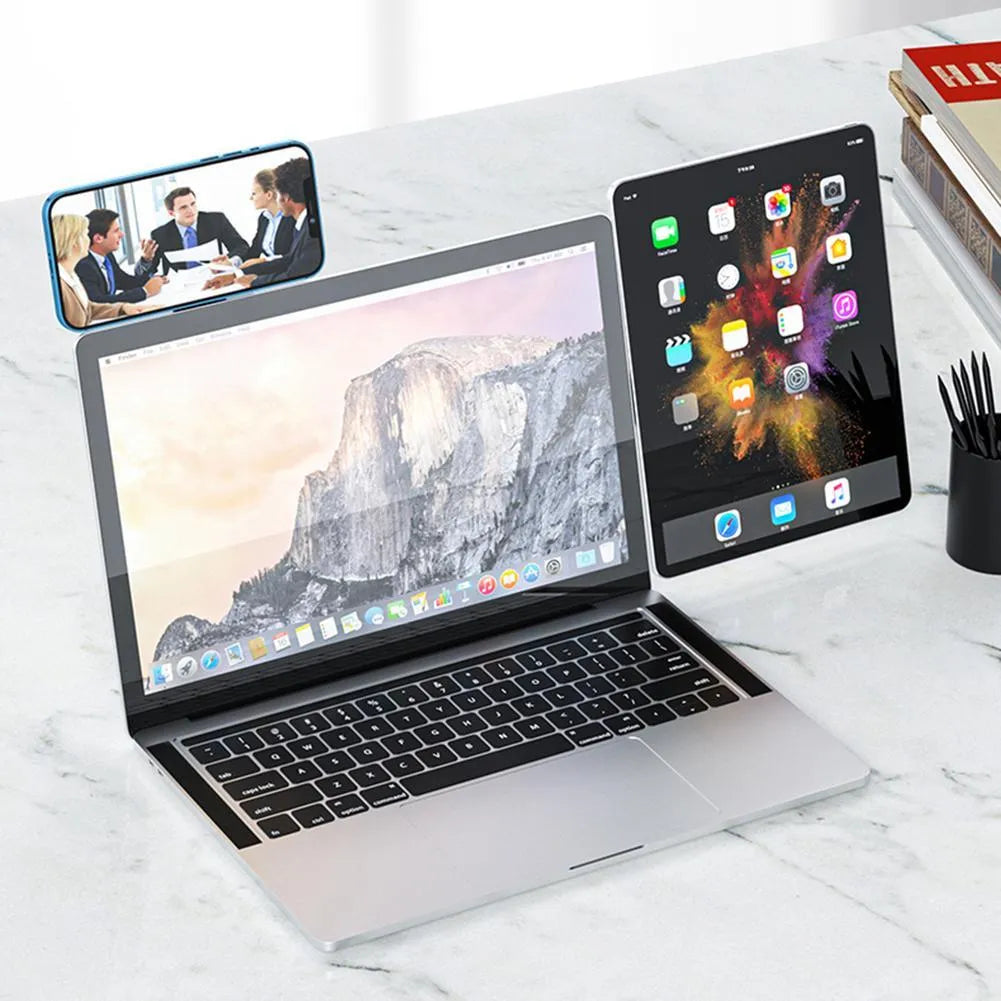Black magnetic laptop phone holder with adjustable clip mounted on computer monitor