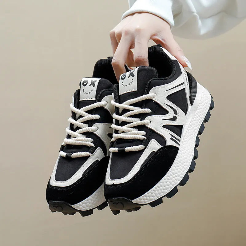 Women's black lace-up platform casual sports shoes with round toe and flat heel.