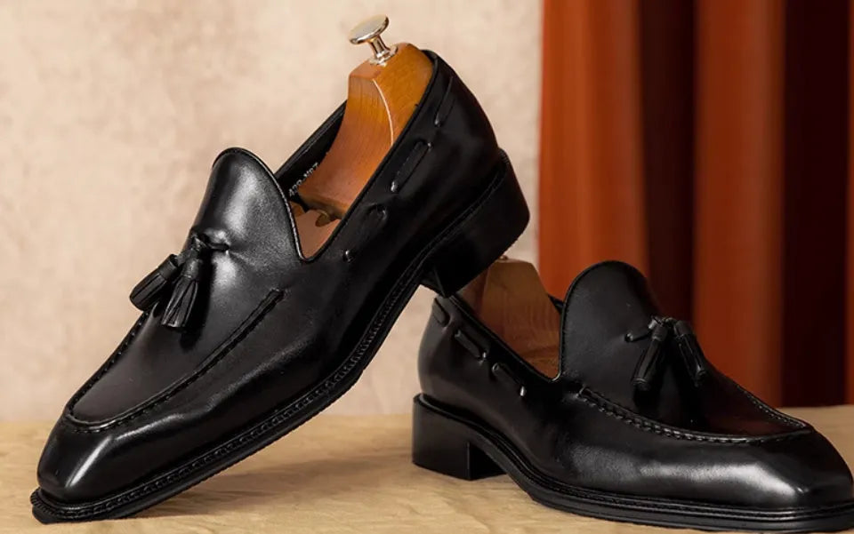 Men's black genuine leather slip-on loafers with rubber sole and pigskin lining