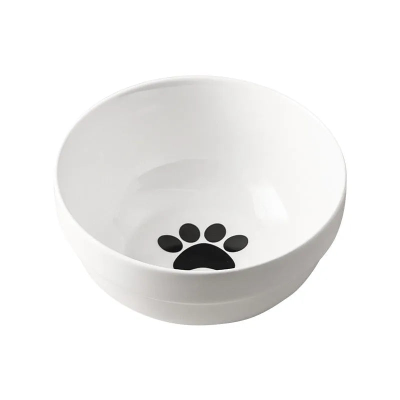 White ceramic cat bowl with cat paw print pattern in a black iron cat-ear frame