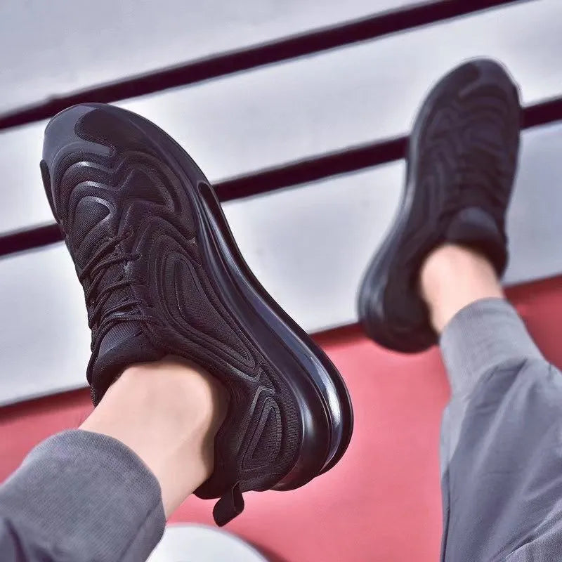 Men's black casual sneakers with a thick sole and lace-up design.