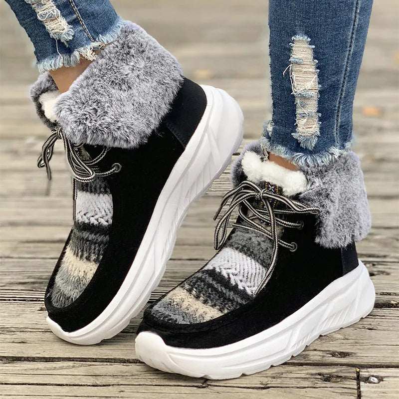 Women's beige lace-up suede snow boots with thermal lining and a thick rubber sole.