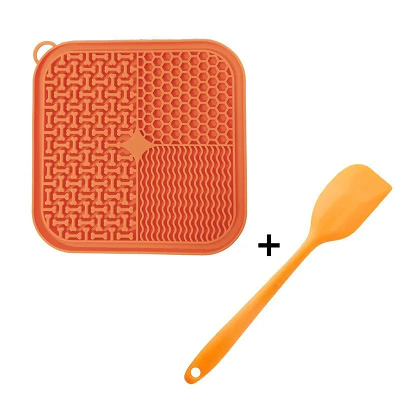 Blue silicone dog lick mat with textured surface and suction cups on back, shown on a tiled floor.