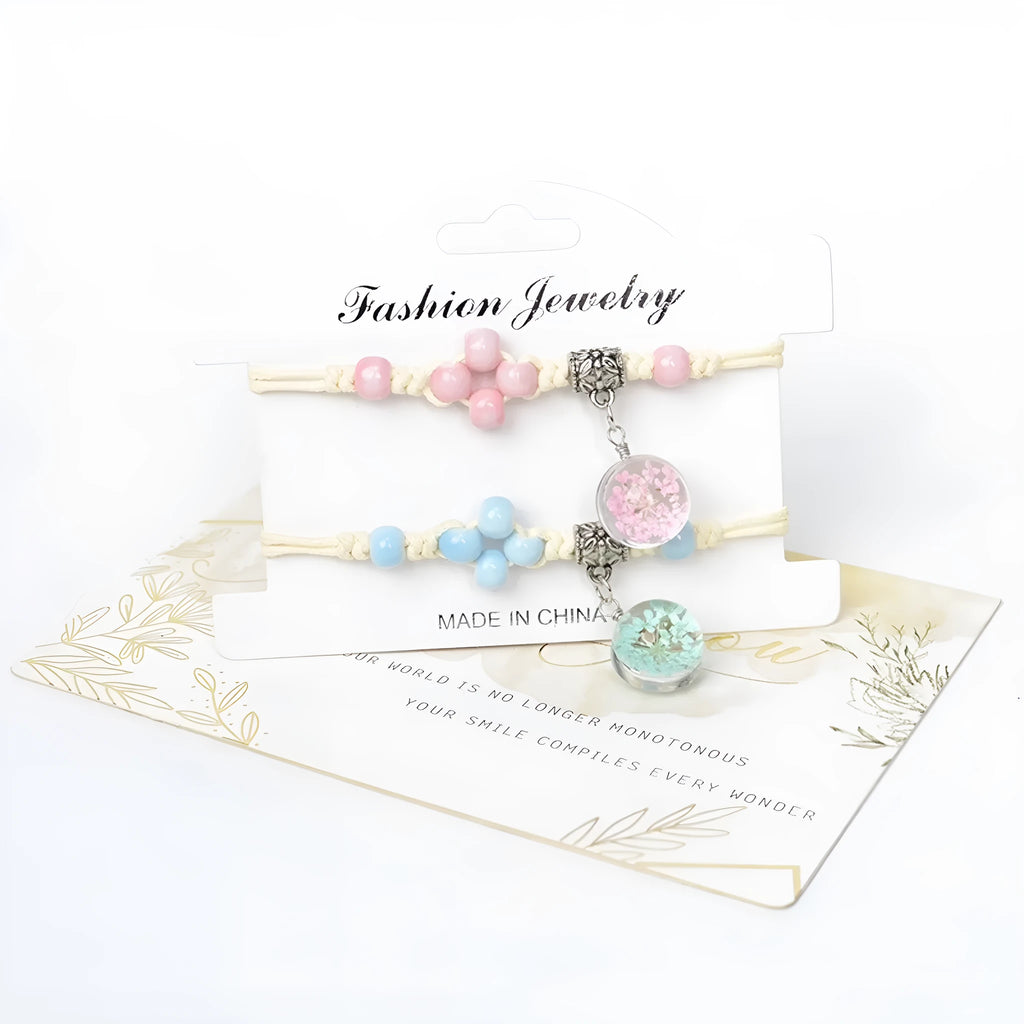 Hand-woven glass bracelet with large 1.4cm beads containing dried real flowers, shown in multiple colour options.
