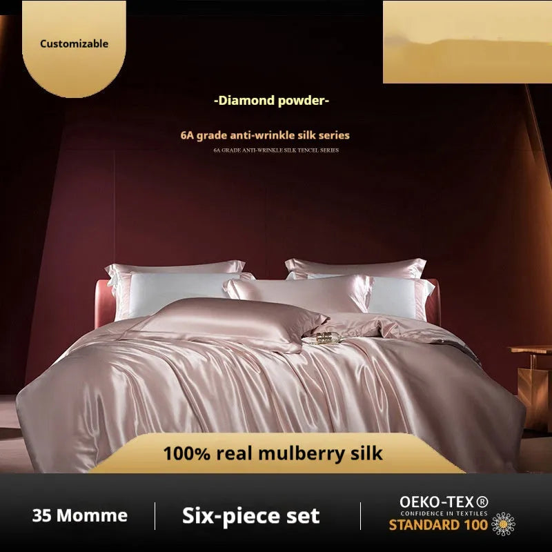 Silk four-piece quilt cover set in a solid colour displayed on a bed, showing the quilt cover and matching pillowcases.