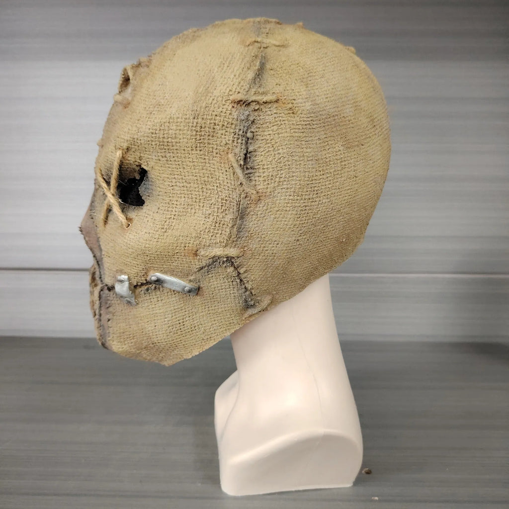 Close-up of a detailed latex scar skull mask head cover for adult Halloween costumes