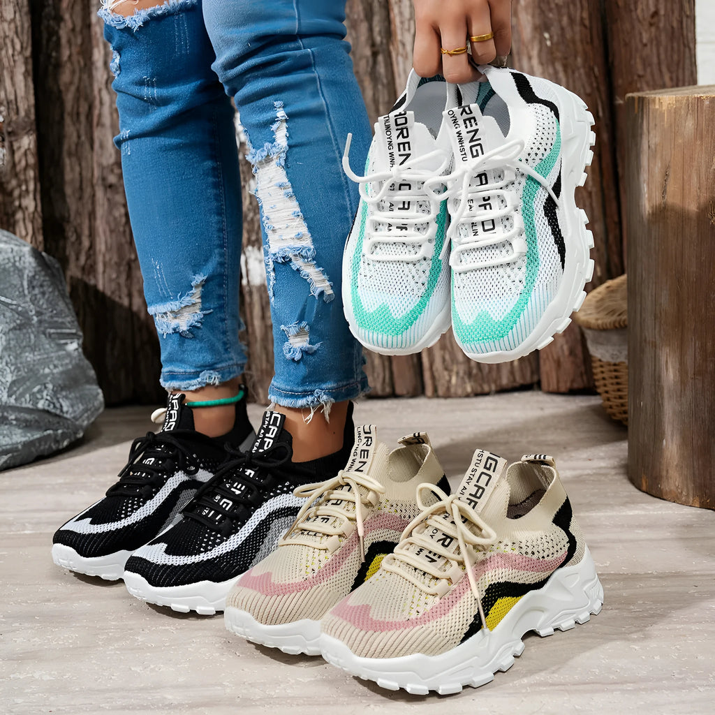 Lightweight women's casual shoes with mesh upper and soft PVC sole in black and white