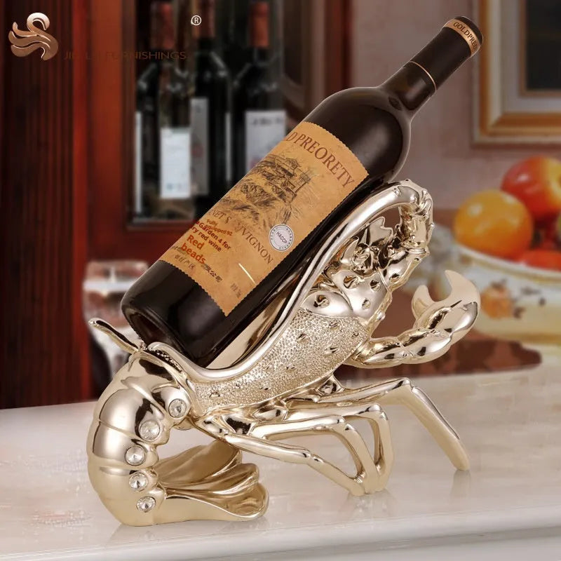 Rose gold resin lobster ornament holding a wine bottle on a wooden shelf.
