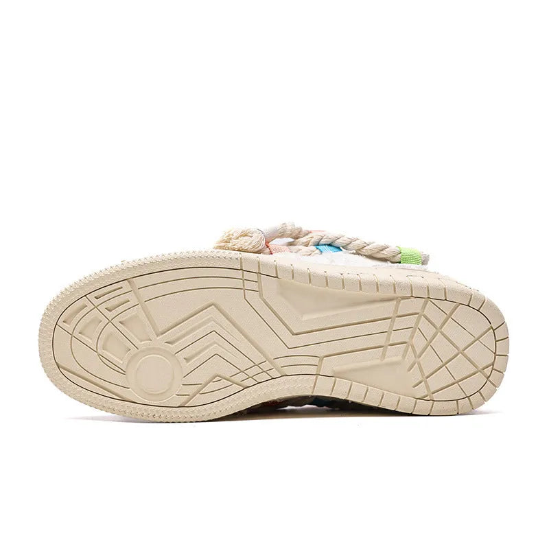 Creamy white low-top retro skate shoes with lace-up front and platform sole.