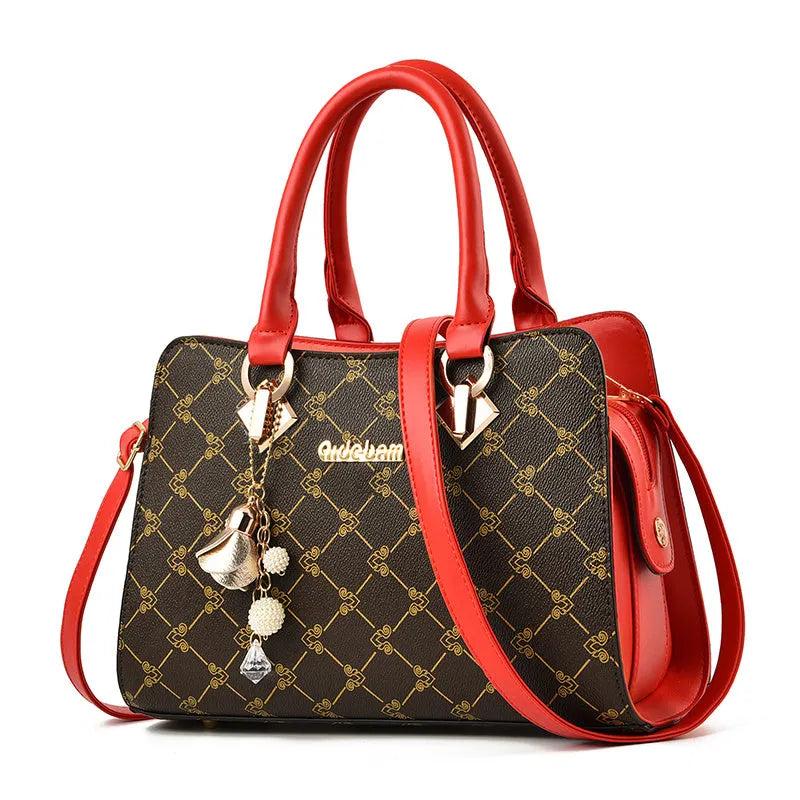 Women's geometric print PU leather messenger bag with internal organisers and zip closure.
