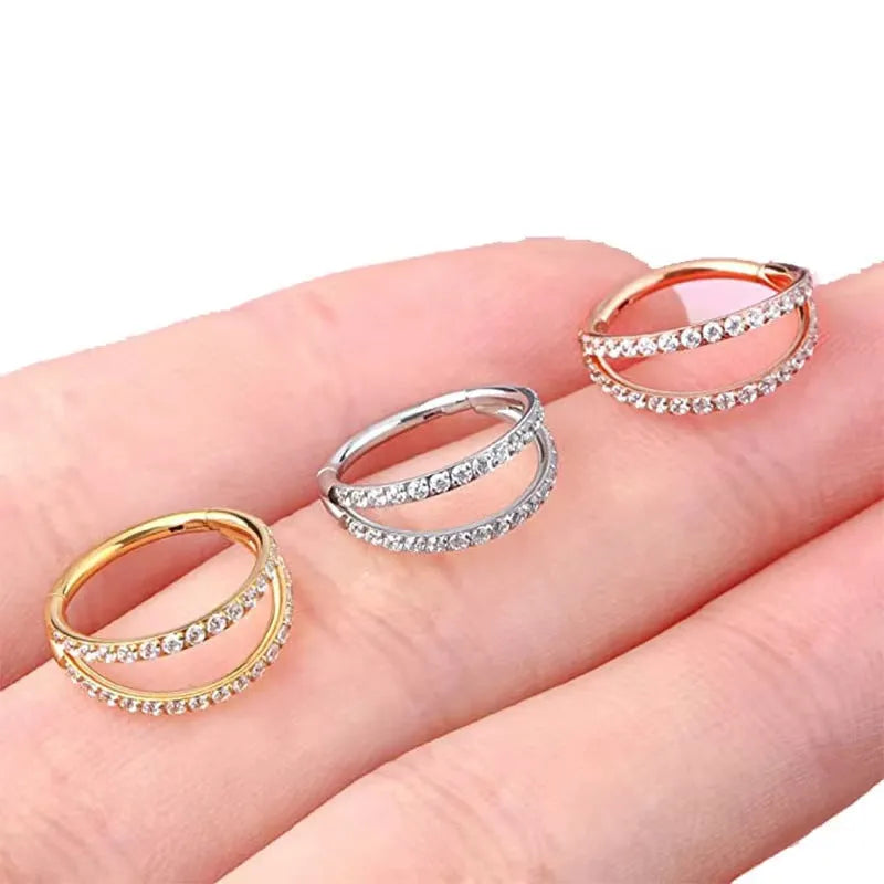 G23 titanium alloy lip and nose ring body jewellery with a zircon stud in gold or steel colour.