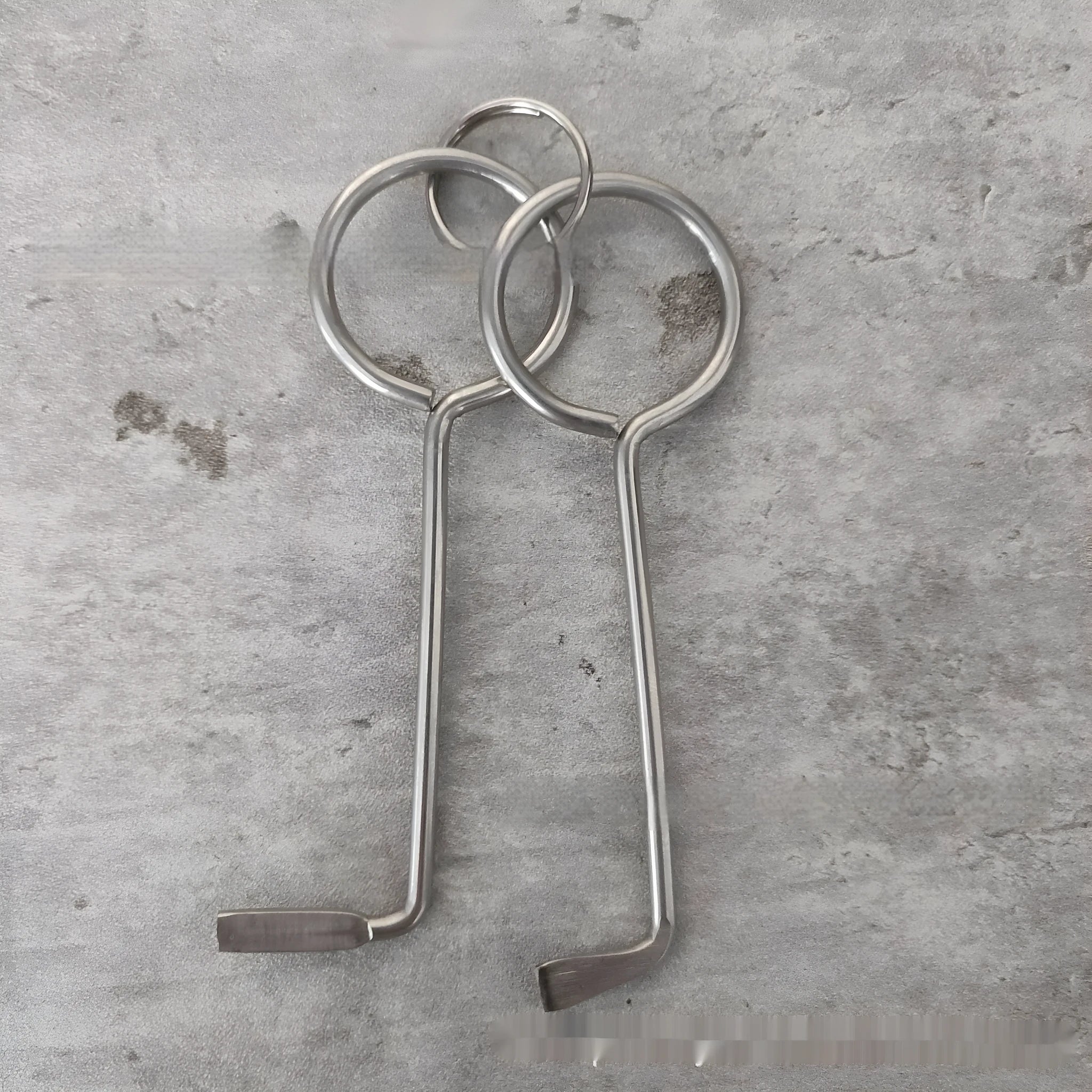 Two-piece alloy wrench tool set showing both wrenches with universal fitting ends