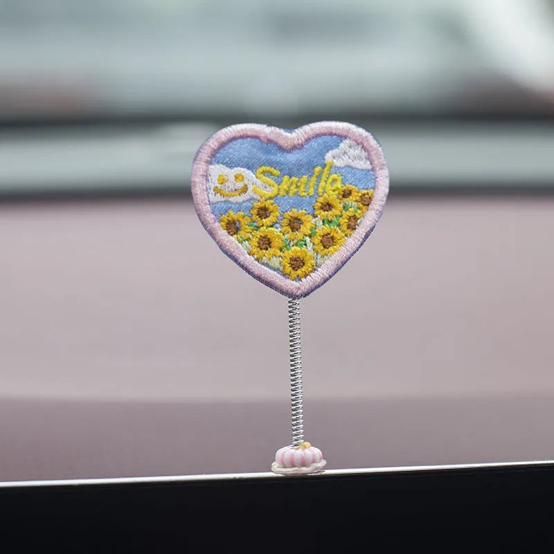 PVC cartoon duckling car decoration set with six small ducks and one Hello sign on a dashboard.
