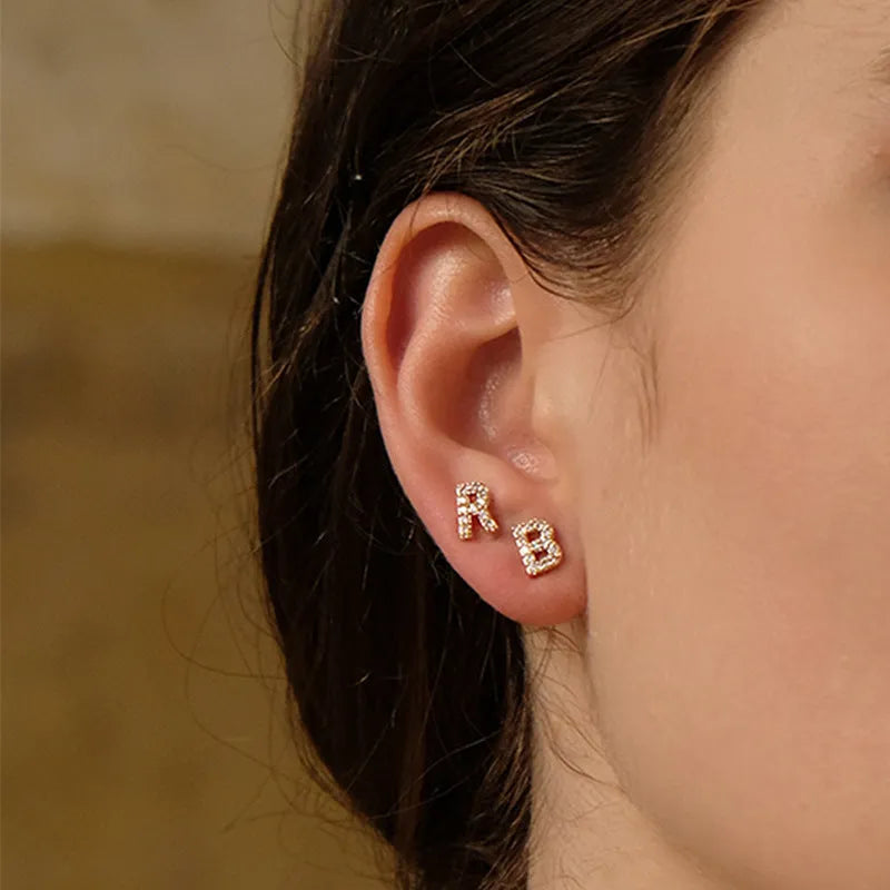 Gold plated brass alphabet letter earrings with zircon detailing showing A-Z character range