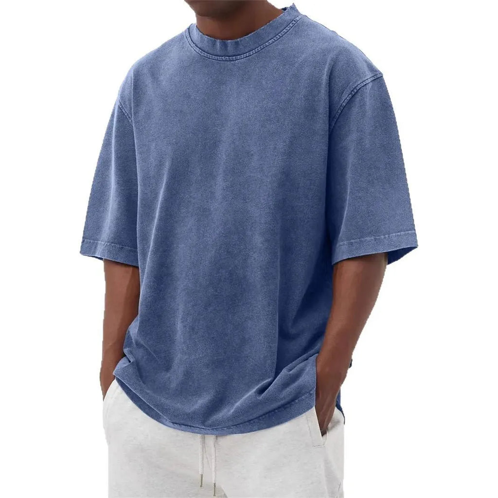 Men's loose-fit stone-washed t-shirt in army green showing distressed texture and pullover style.