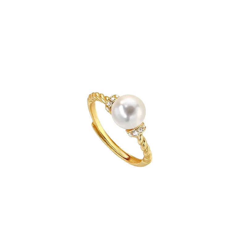 Geometric copper ring with antique twist design and pearl inlay, adjustable sizing shown