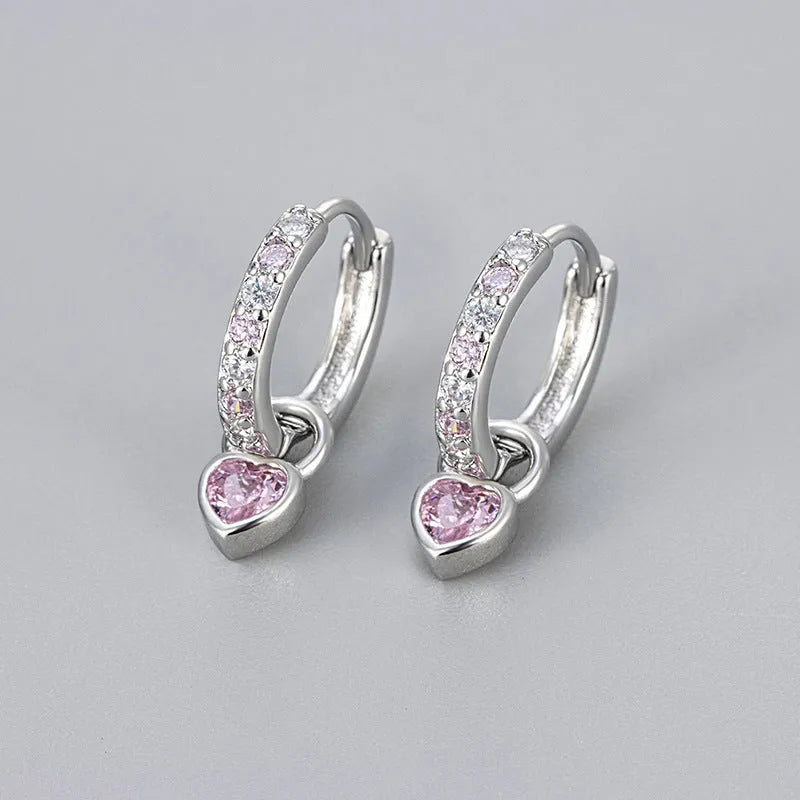 Women's heart-shaped ear clips with a coloured stone, available in gold or white gold colour.