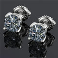 Silver moissanite screw-back stud earrings with four-claw setting on black card