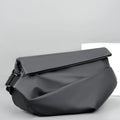 Grey PU crossbody bag with single adjustable shoulder strap showing interior phone pocket