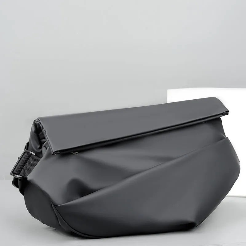 Grey PU crossbody bag with single adjustable shoulder strap showing interior phone pocket