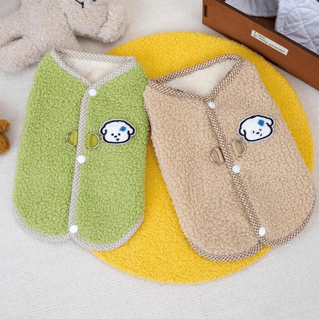 Green coral fleece dog vest with a D-ring leash attachment on a small dog.