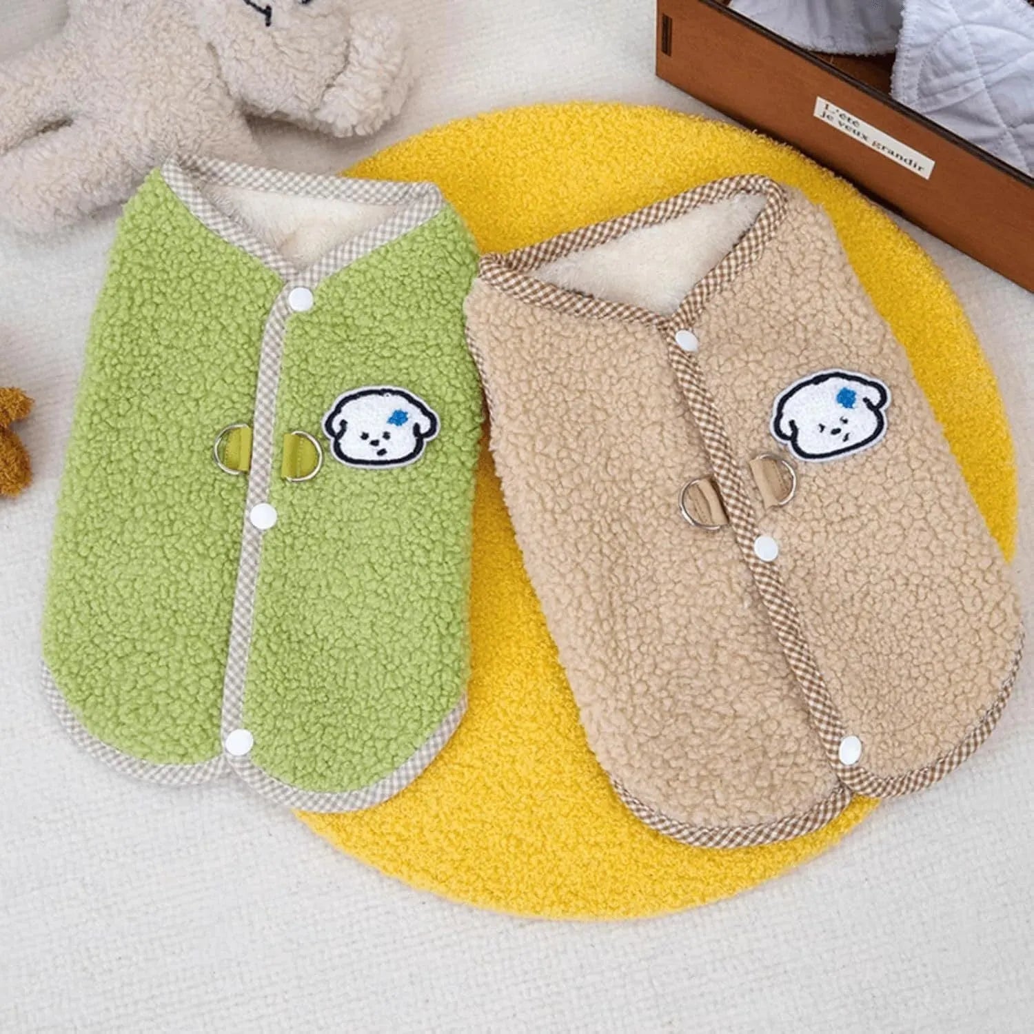 Green coral fleece dog vest with a D-ring leash attachment on a small dog.