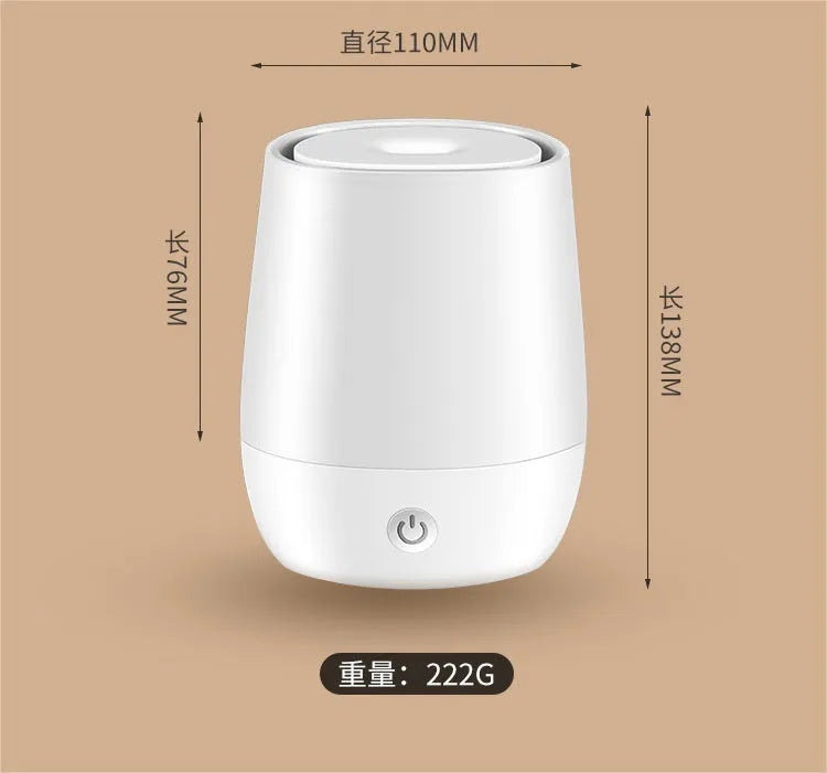 White USB aroma diffuser humidifier with flickering flame effect light on a wooden surface.