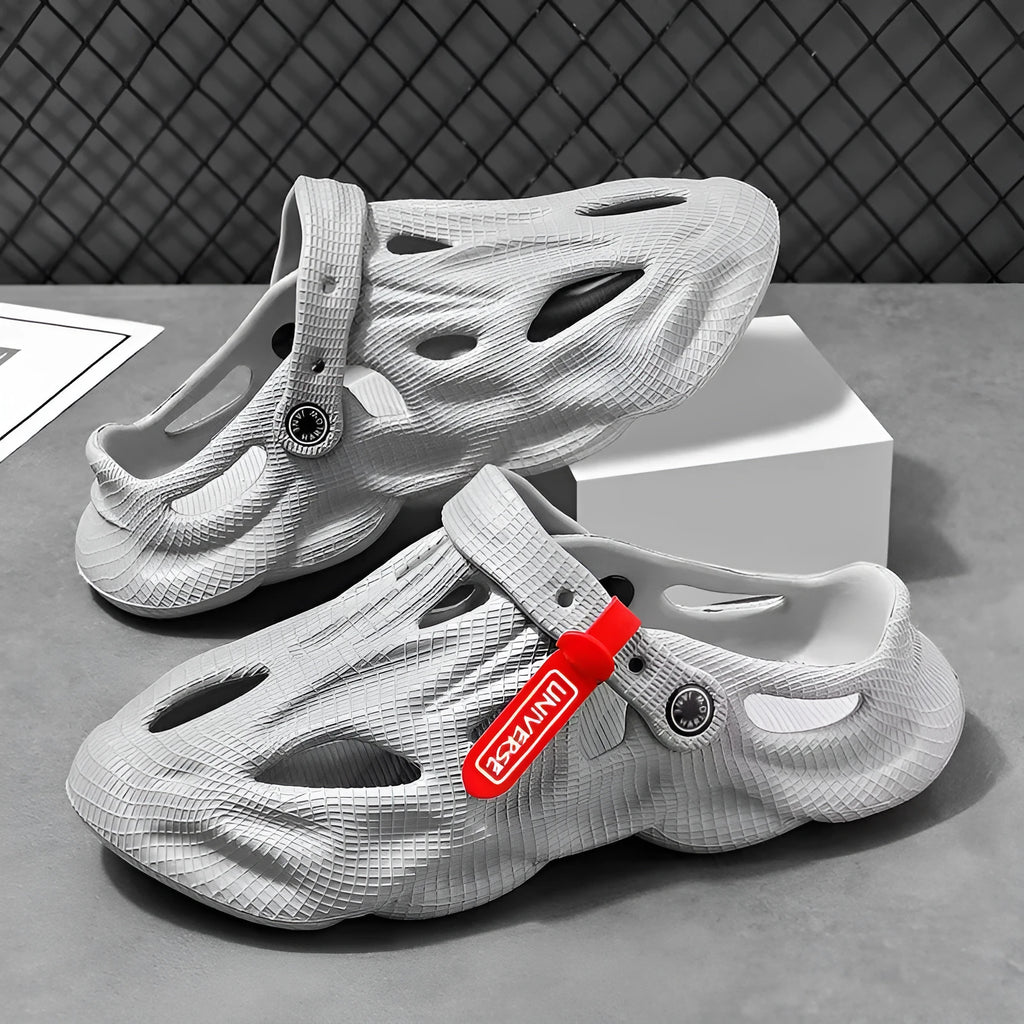 EVA foam coconut slippers with closed toe design and ventilation holes in grey colour