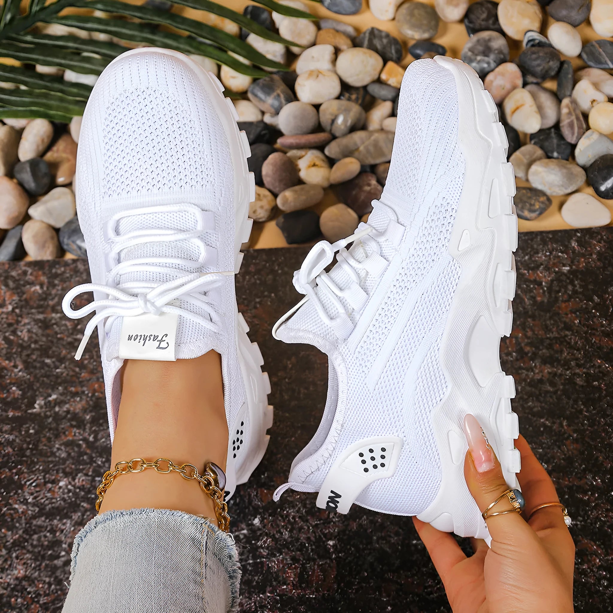 Women's low-top mesh sports sneakers in beige with front lace-up and a subtle platform sole.