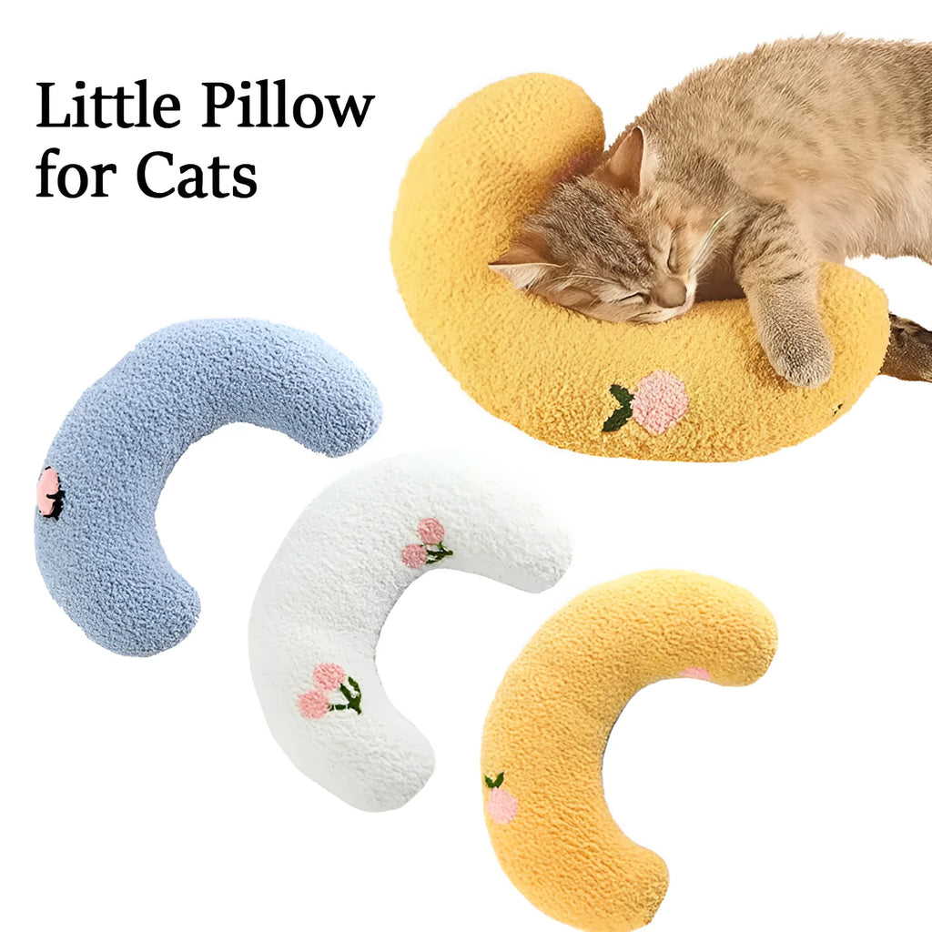 Small blue U-shaped plush pillow for cats or small dogs on a white background.