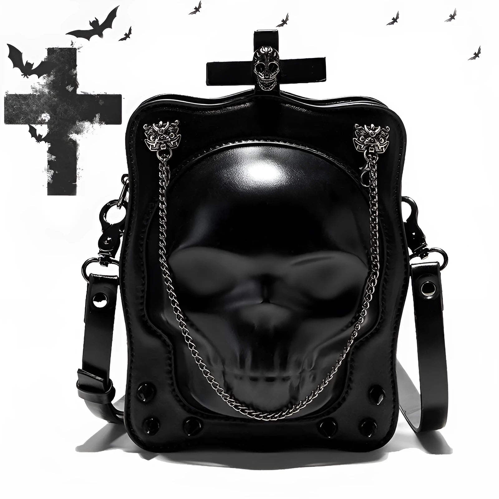 Black mini square crossbody bag with embossed skull design, decorative stitching, rivets, and chain details.