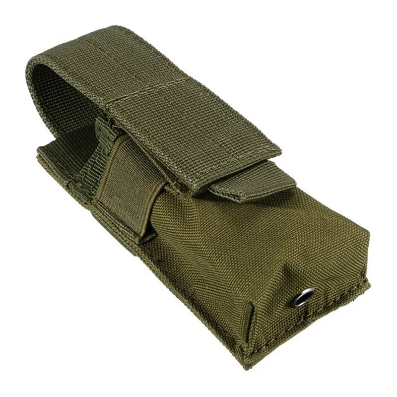 Black tactical Molle waist bag with elastic cord closure, shown next to a pistol cartridge for scale.
