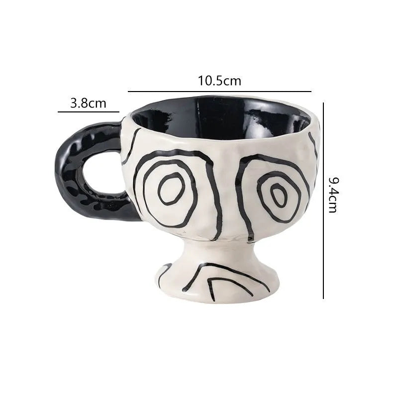 Hand-pinched irregular shaped ceramic mug in a solid colour, shown from the side.