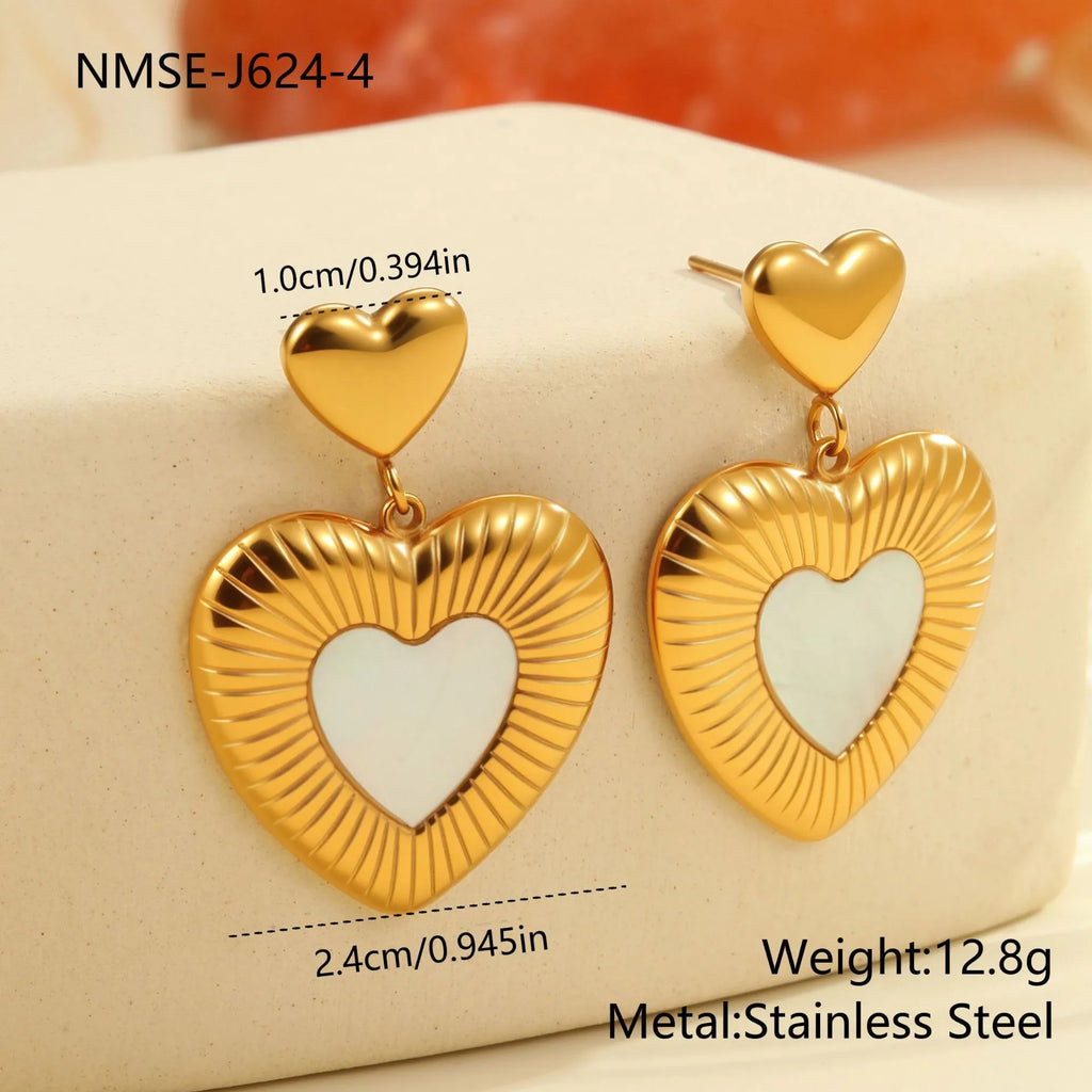 Gold heart-shaped stainless steel stud earrings for women with a love motif.