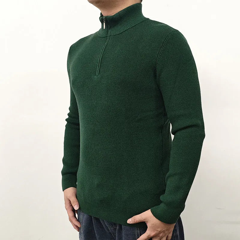 Man wearing a grey cotton blend half-turtleneck zip sweater with long sleeves