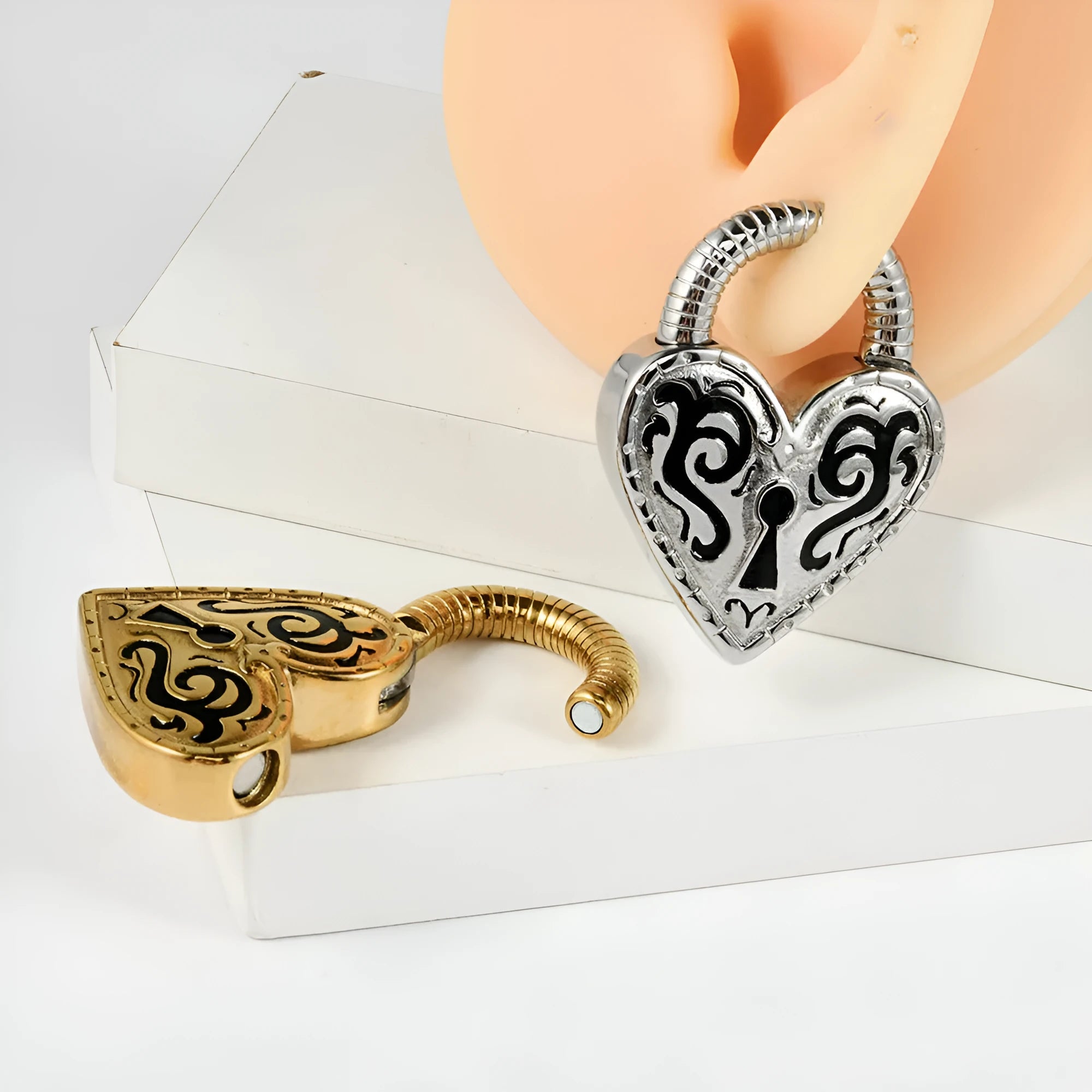 Heart-shaped stainless steel earring with electroplated finish in gold or steel colour options
