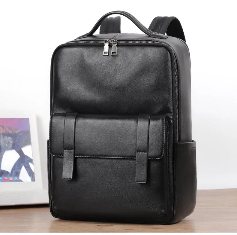 Black genuine leather men's computer backpack with woven details and ergonomic back plate